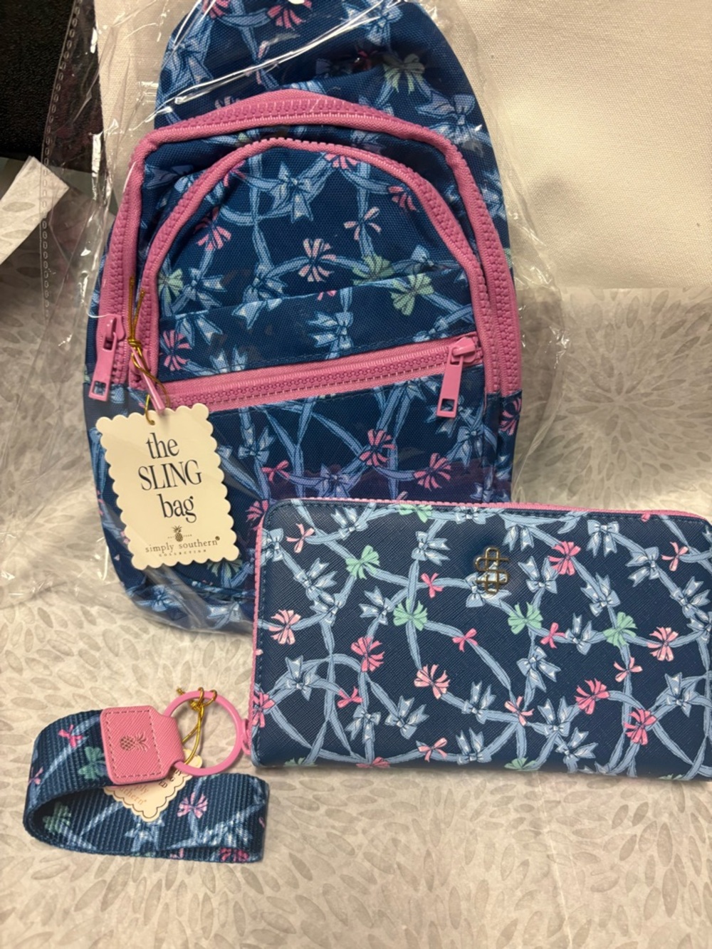 Simply Southern Navy Floral Sling Bag with Pink Accents and Matching Wristlet